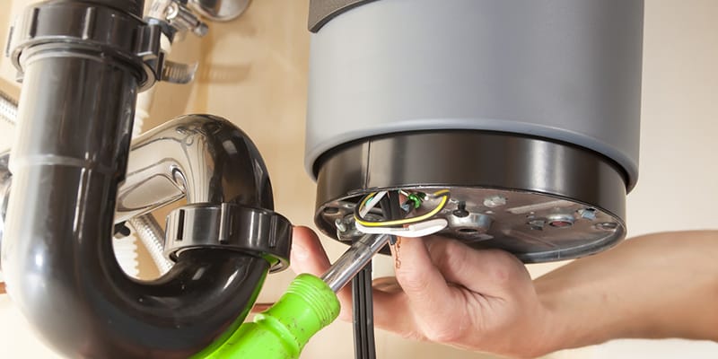 Technician repairing the heating element of a water heater in Ruskin